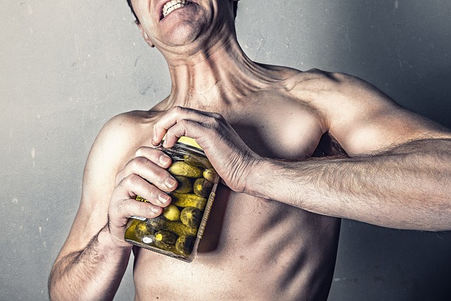 Intermittent Fasting For Overweight People:  Man opening jar of pickles