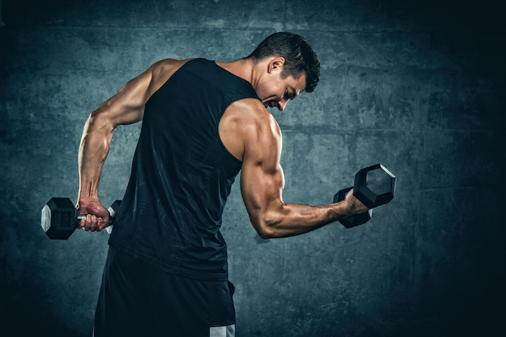 What Are the Best Exercises To Increase Your Testosterone Levels: Man lifting dumbbells